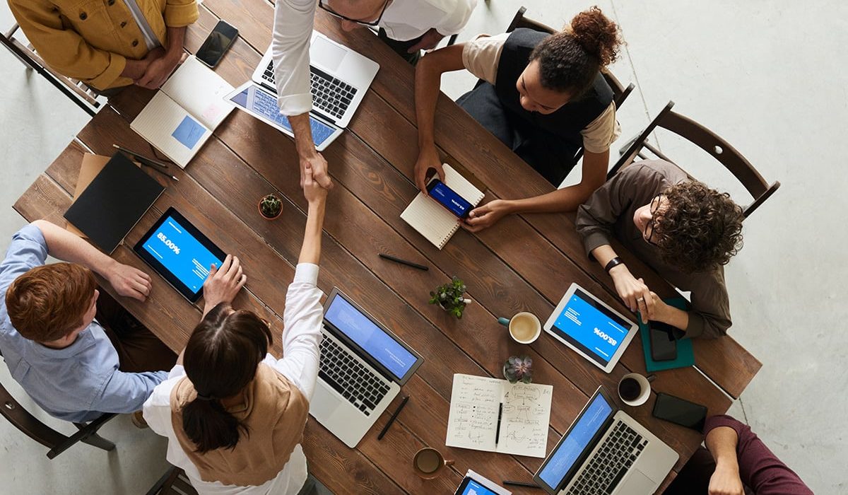 Business investors gathered around the table to discuss ideas